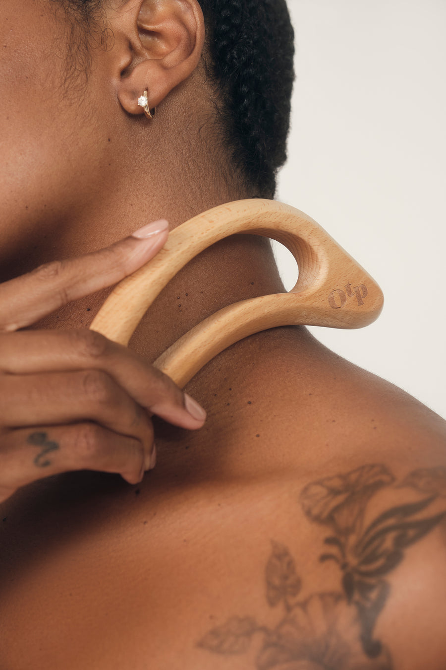Model using SHAPE SHIFTER Massage Tool on neck | OUI the People